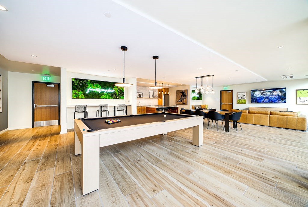 a living room with a pool table