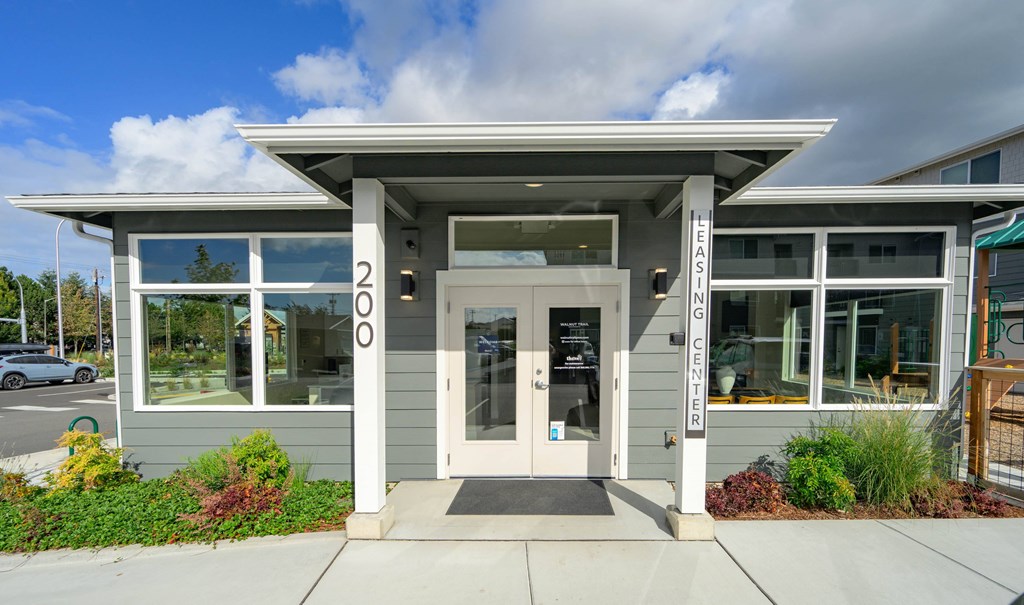 The front of a building with the words "LEAN GENERATION" on a pillar.