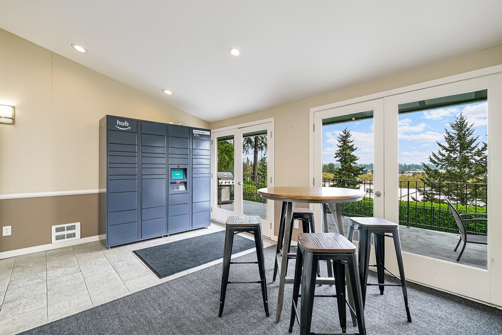 a bar with three stools in front of a window and a door to a