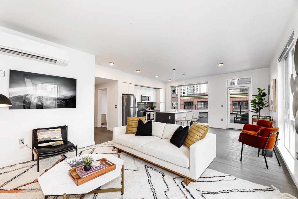 a living room with a white couch and a coffee table