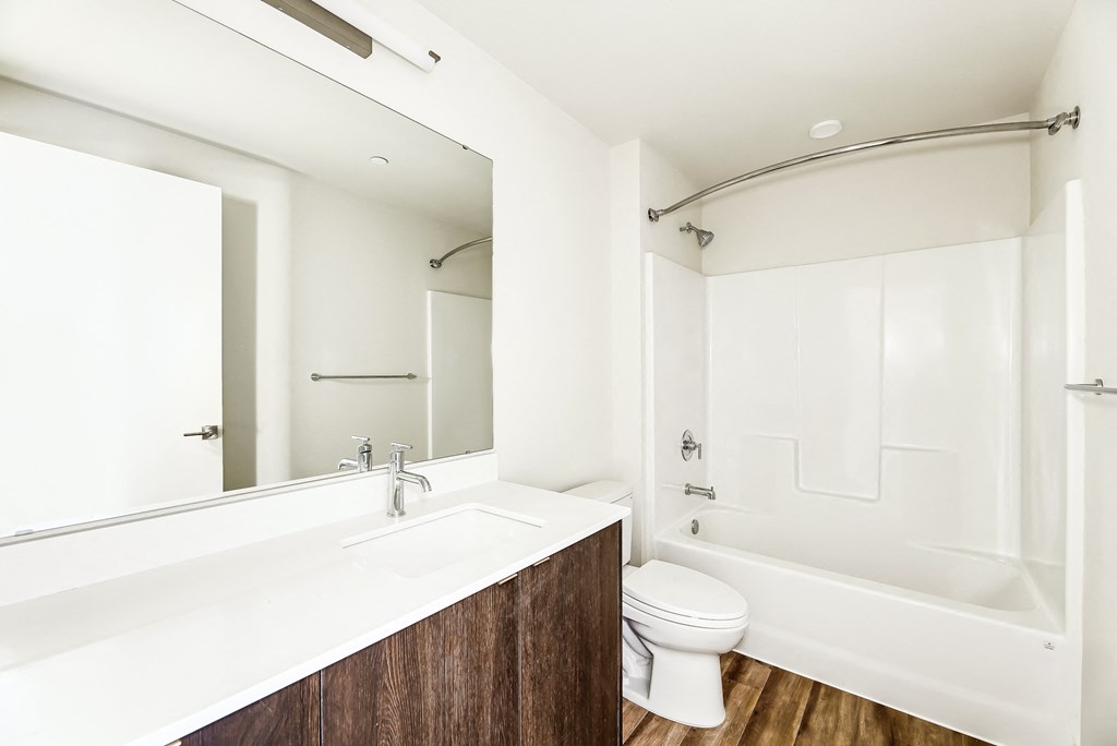 a bathroom with a toilet sink and bathtub