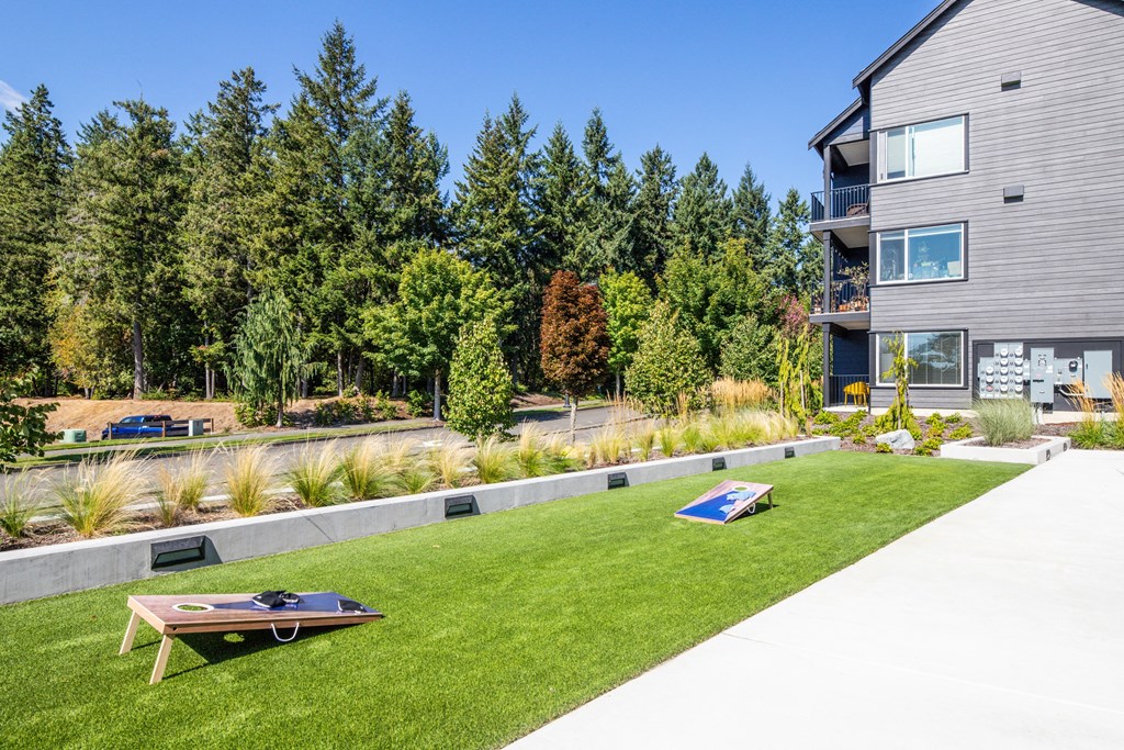 a yard with a ping pong table and a house