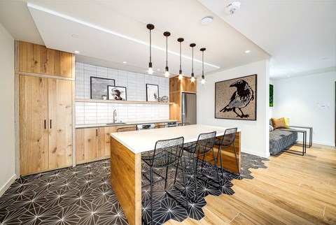 a kitchen and dining area with a table and chairs