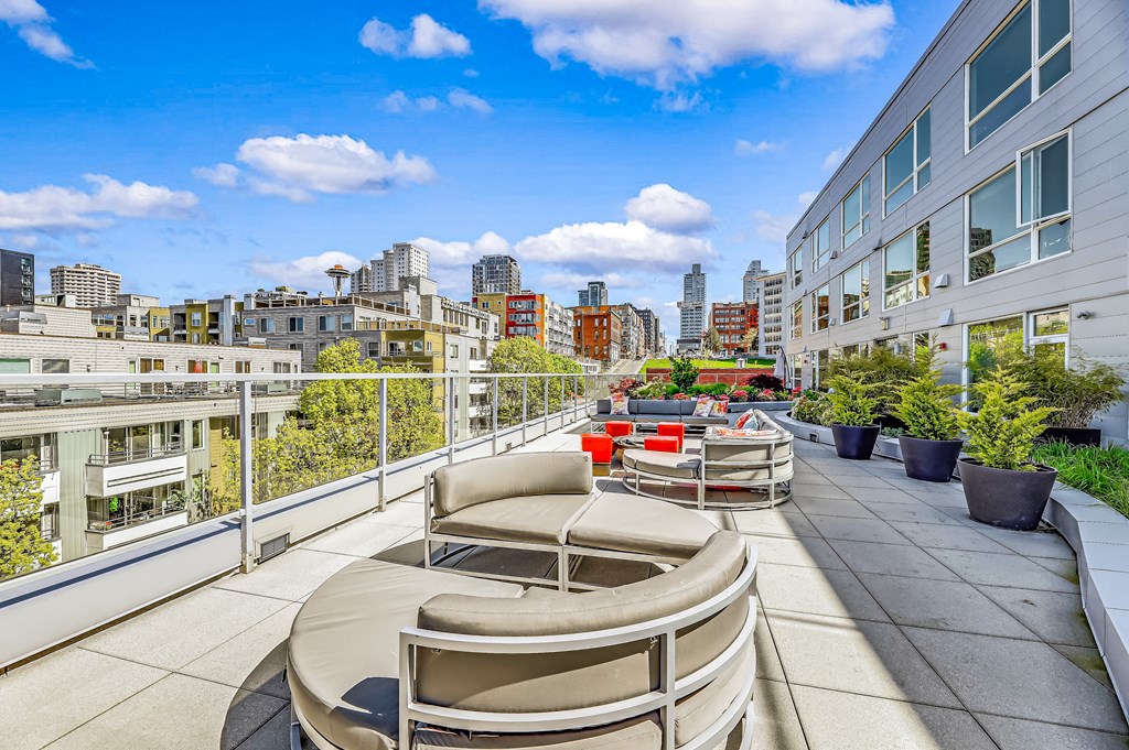 the apartment has a large terrace with views of the city