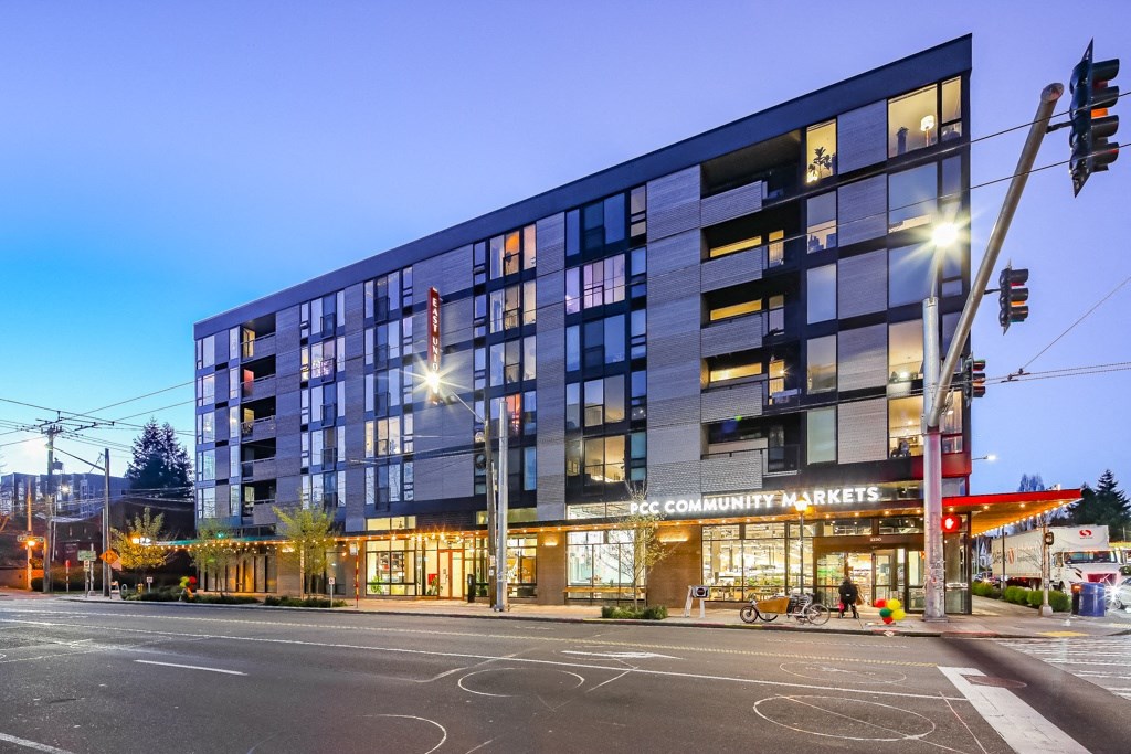 a large building on a city street at night