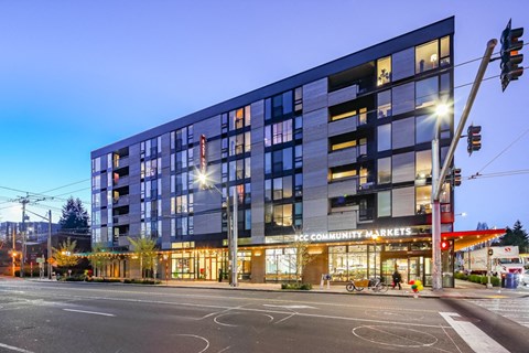 a large building on a city street at night
