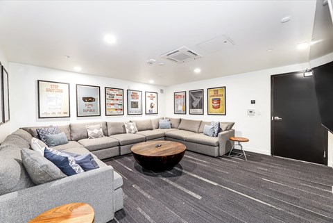 a living room with couches and a coffee table