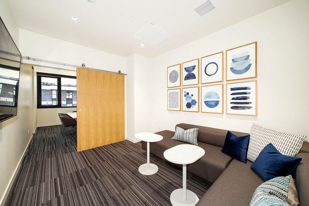 a living room with a couch and tables