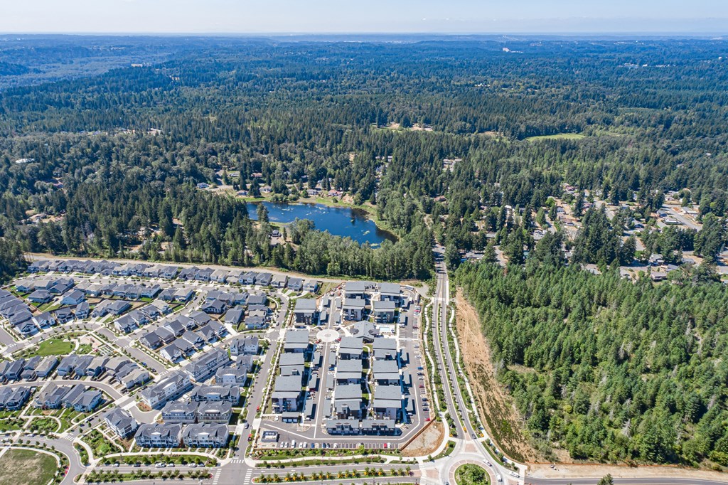 an aerial view of an industrial park and a lake