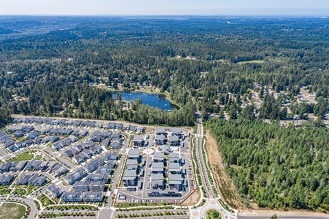 an aerial view of an industrial park and a lake