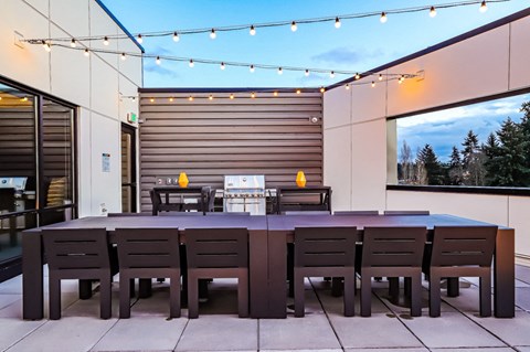 A table with chairs is set up outside on a patio.