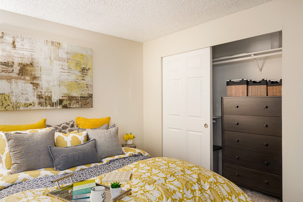 a bedroom with a bed and a closet