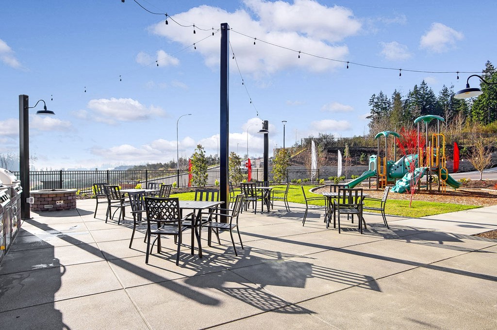 A playground with a slide and a play structure.