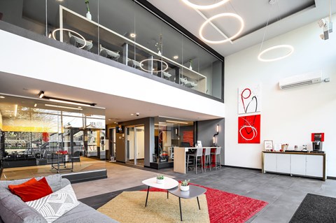 a living room with a couch and tables
