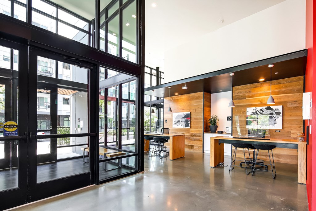 a large room with glass doors and a table and chairs