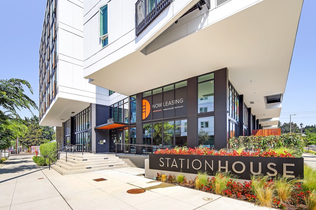 an exterior view of the station house building with a sign in front of the entrance