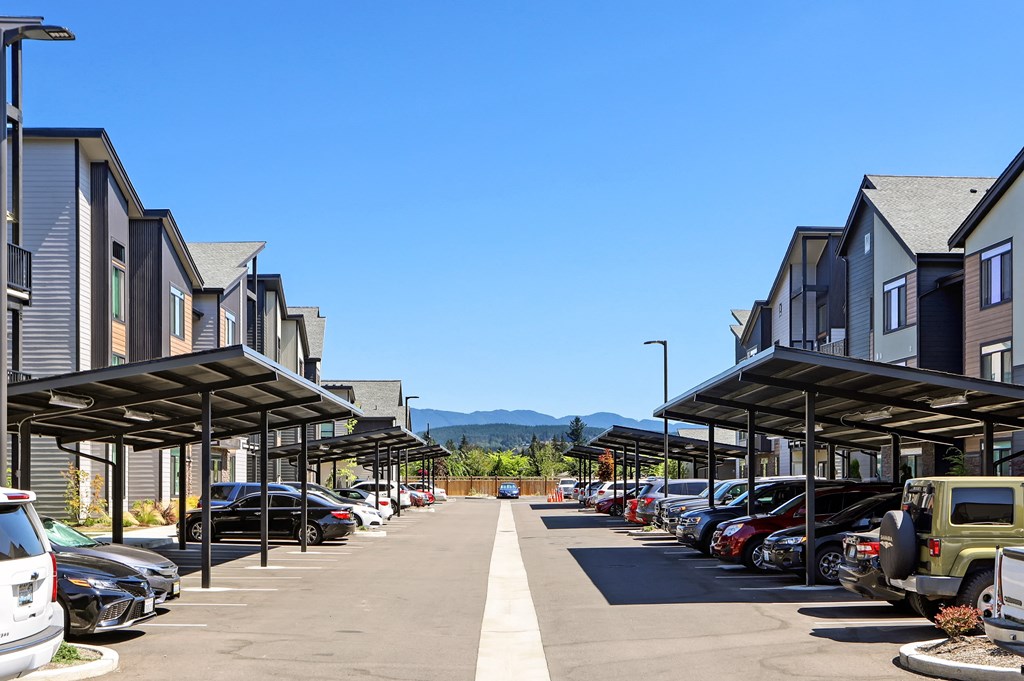 a row of cars parked on the side of a street