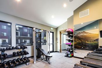 24/7 Fitness Center with Serene Wetland Views