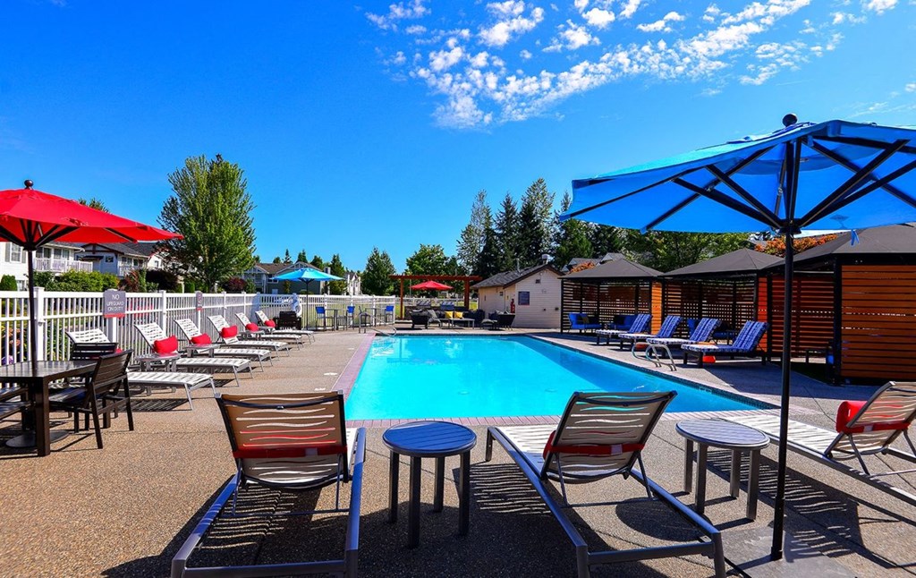 pool with lounge chairs at Clock Tower Village, Washington, 98327