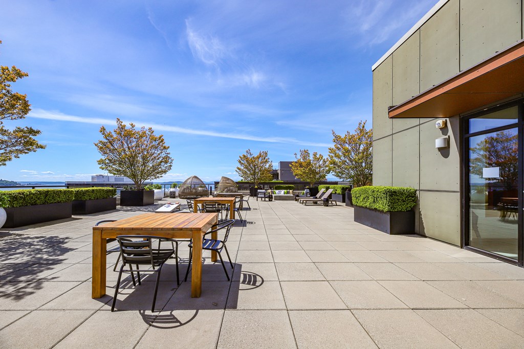 the terrace of a restaurant with tables and chairs