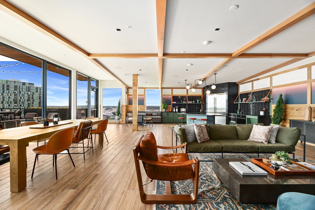 A modern living room with a wooden floor and furniture.