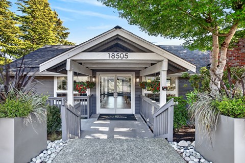 The house number is 18505 and it is surrounded by greenery.