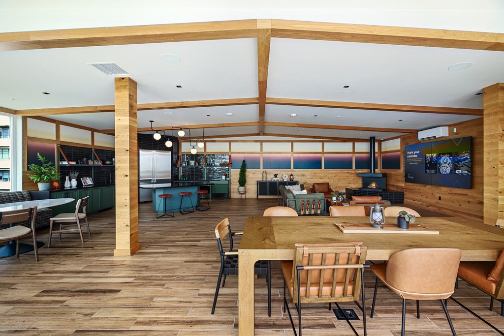 A room with a long table and chairs.