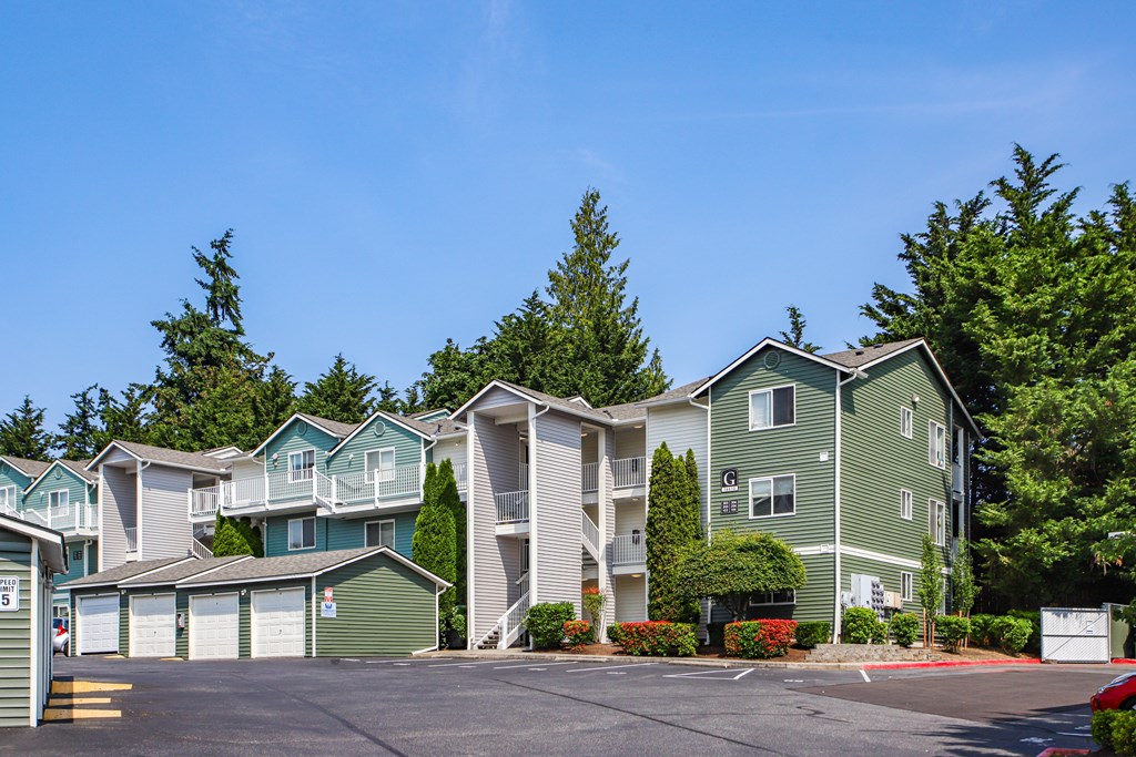 A row of houses with a clear blue sky above them.