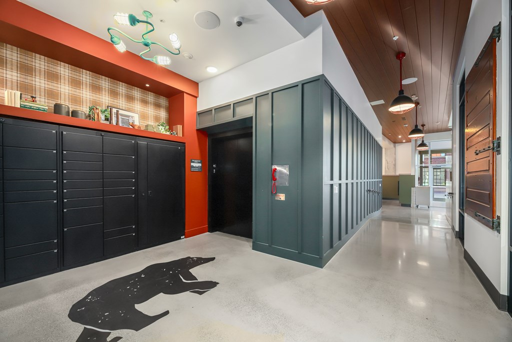A hallway with a black silhouette of a person on the floor.