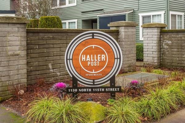 A sign for Haller Post in front of a building.