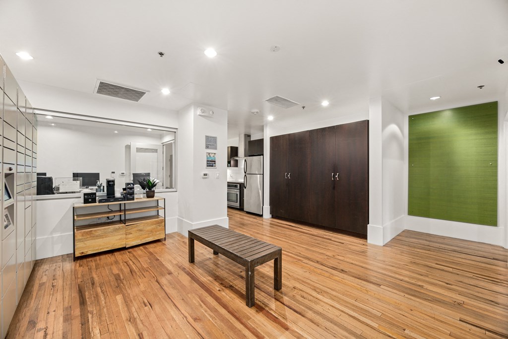 a living room with a wood floor and a wooden bench