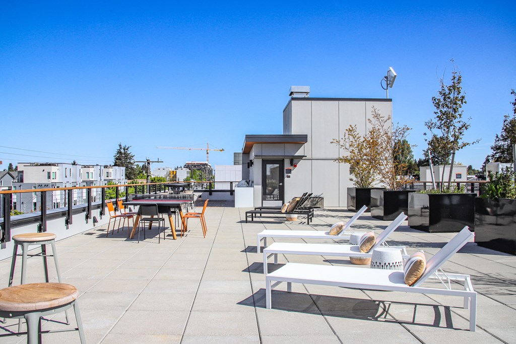 the terrace of the ace hotel has tables and chairs