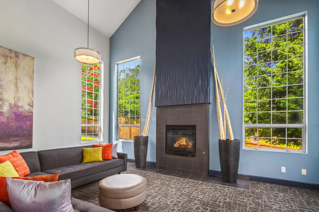 a living room with couches and a fireplace