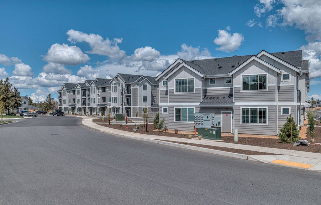 a large house with a sky background and hearts around it