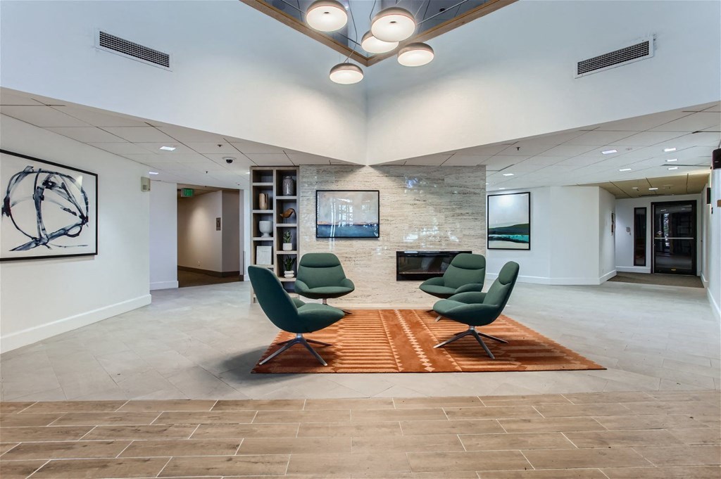 the preserve at cardinal woods lobby with chairs and a fireplace
