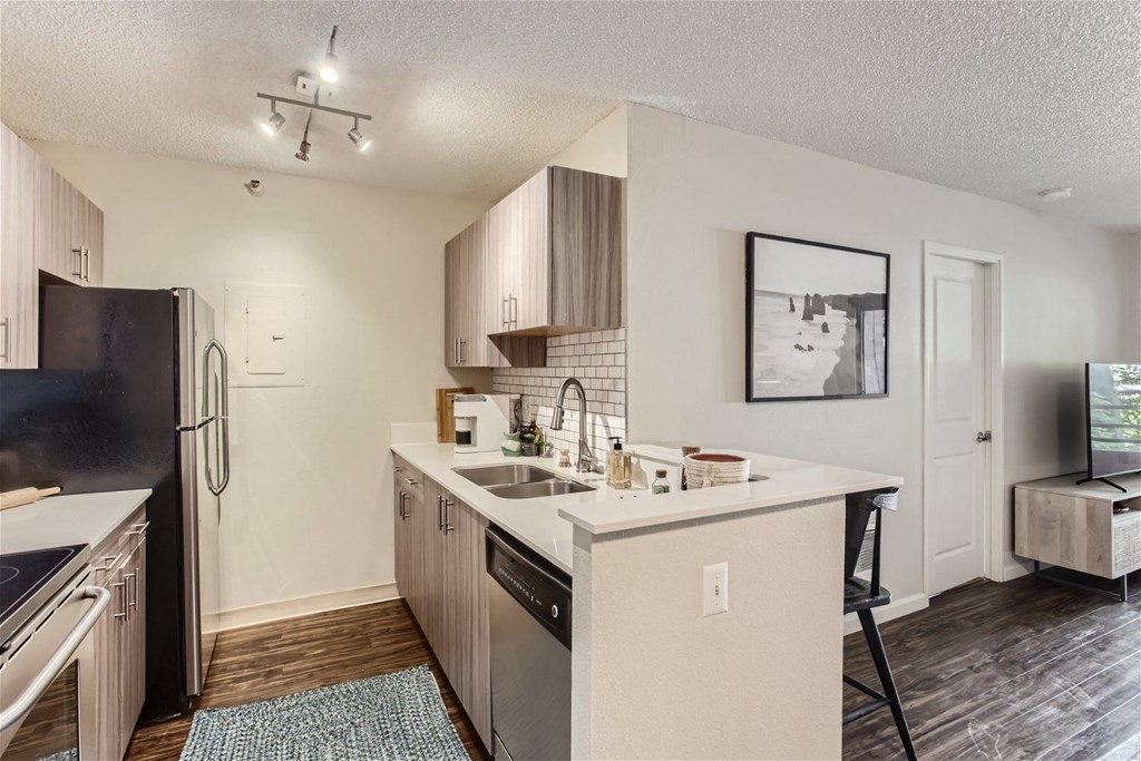 the preserve at ballantyne commons apartment kitchen with stainless steel appliances