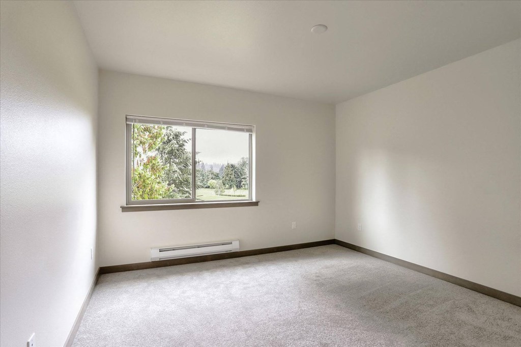 an empty room with a window in it