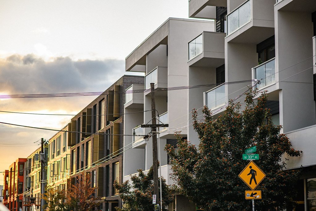 a row of apartment buildings on a city street