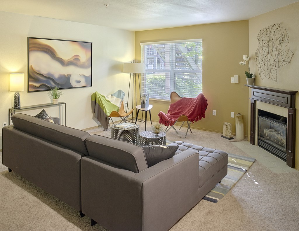a living room with a couch and a fireplace