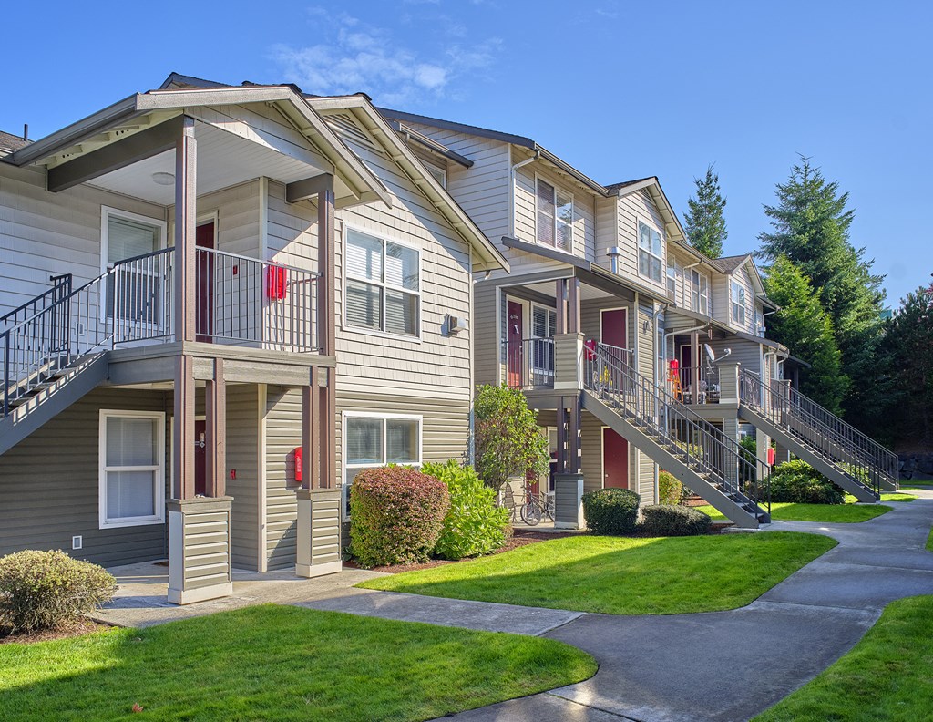 a street view of an apartment building with balconies
