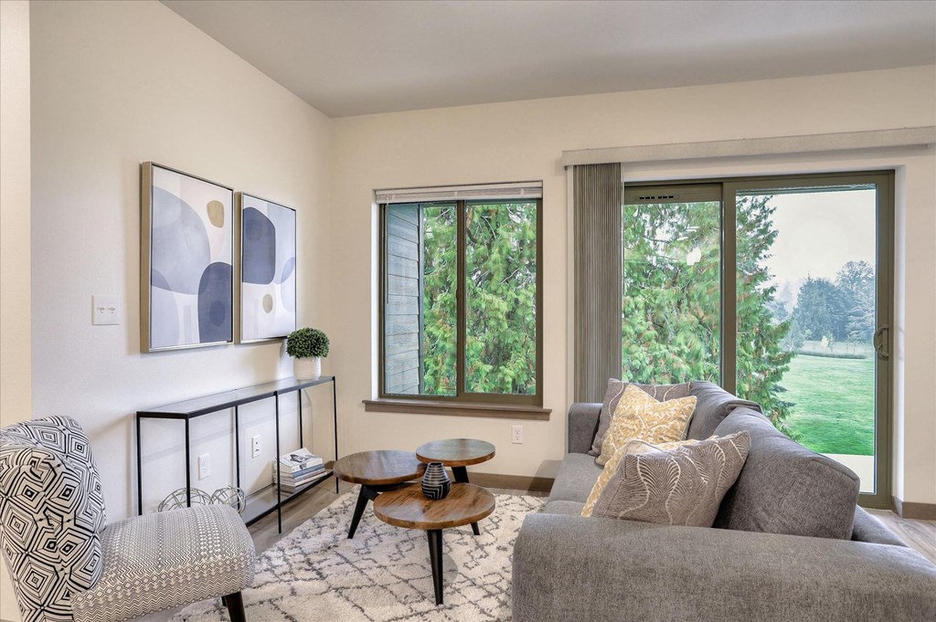 a living room with a couch and a window