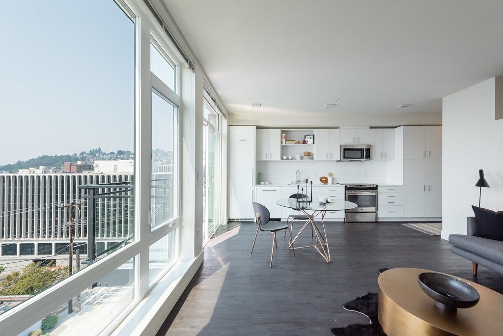 a view of the living room and kitchen from the balcony