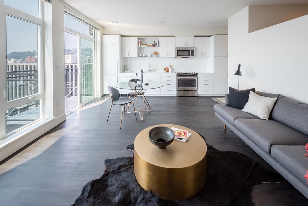 a view of the living room and kitchen in a 555 waverly unit