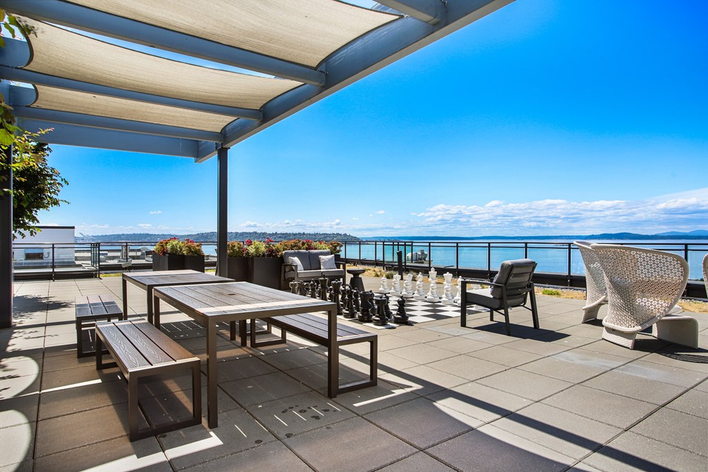 the deck has a view of the ocean and the mountains