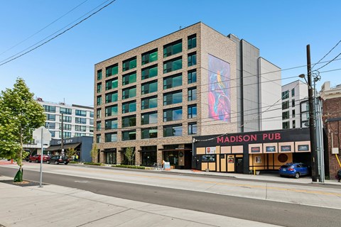 A large building with a pub sign on the front.
