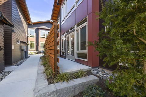 A modern building with a red and purple facade.