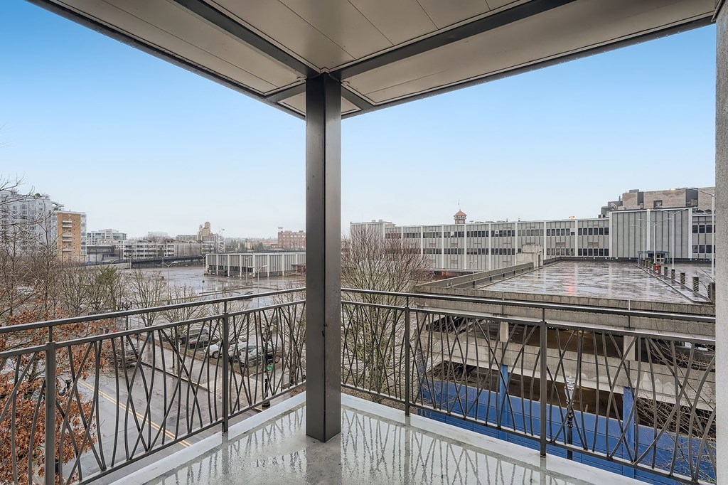 a view of the city from the balcony of a building