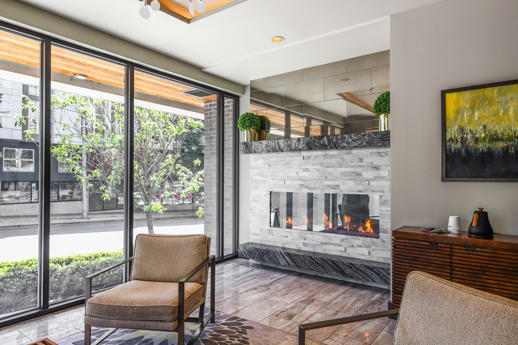 the living room has a fireplace and a sliding glass door