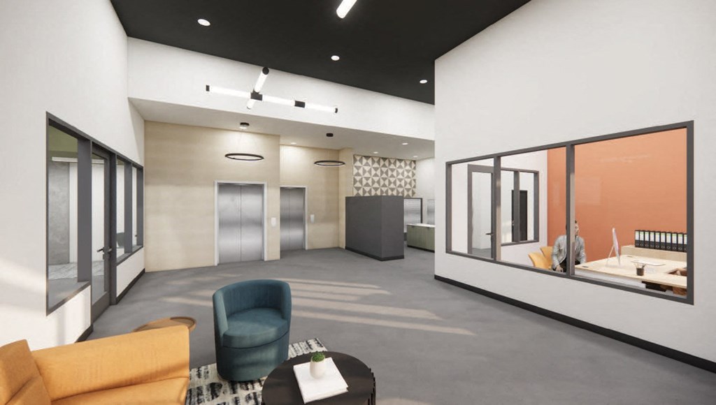 a large room with couches and chairs and a large window