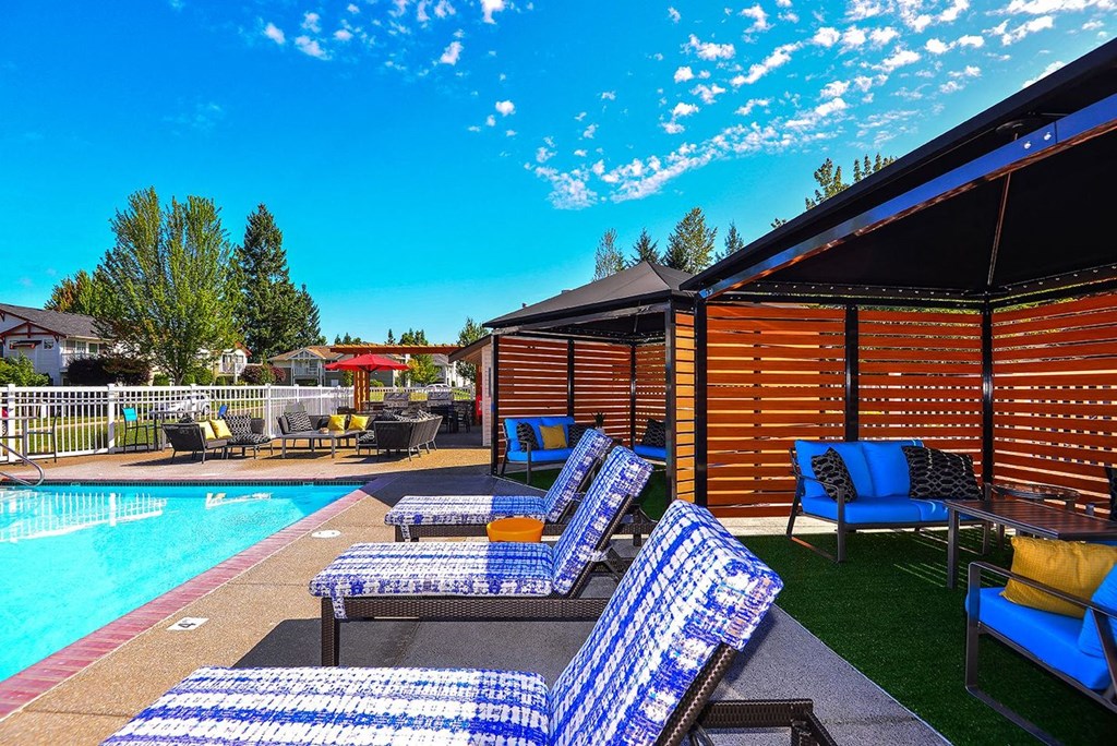 pool with lounge chairs at Clock Tower Village, Washington